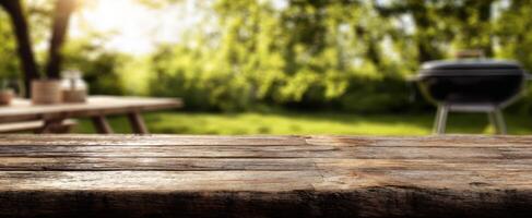 The rustic wooden table setting perfect for a summer barbecue gathering. photo