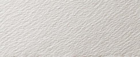 The textured white paper featuring an elegant surface for artistic creations. photo