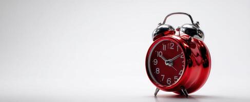 The classic red alarm clock enhancing your space with vibrant timeless elegance. photo