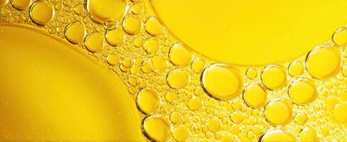 The mesmerizing beauty of yellow oil bubbles in close-up abstract art. photo