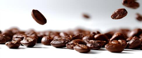The floating coffee beans scattering across a pristine white surface. photo
