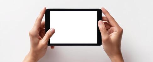 The hands holding a blank tablet for personal or business applications. photo