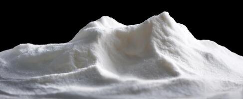 The captivating texture of a mountain of white powder against a dark backdrop. photo
