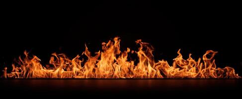 The mesmerizing flames dancing in a dark background. photo