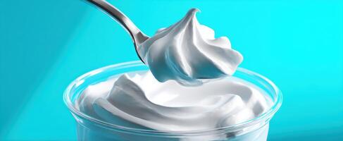 The creamy whipped topping beautifully captured against a vibrant turquoise background. photo