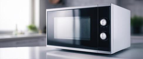 The modern microwave oven on a sleek kitchen countertop photo