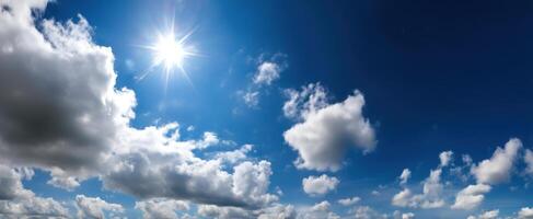 The Radiant Sun Shining Through Fluffy White Clouds in a Clear Blue Sky photo