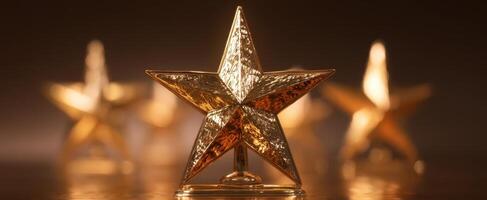 The golden star trophy symbolizing achievement and recognition. photo