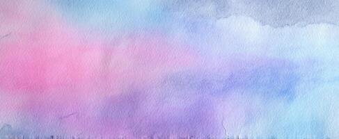 The abstract watercolor background in soft pastel hues of pink and blue. photo