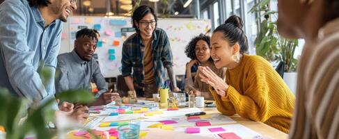 The team collaborates joyfully during a vibrant brainstorming session in an office. photo