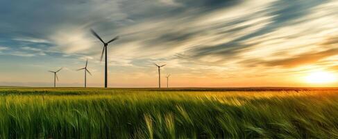The Majestic Wind Turbines Against a Vibrant Sunset Landscape photo