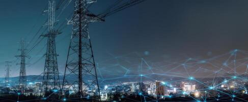 The power transmission lines illuminating the urban landscape at night. photo