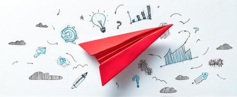 The red paper airplane soaring through innovative business ideas and concepts. photo