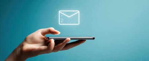 The smartphone with email icon illustrating modern communication technology photo