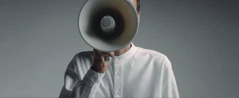 The man holding a megaphone conveying an important message in a minimalist style. photo