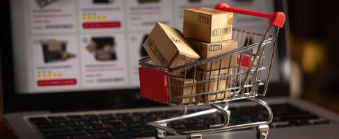 The shopping cart filled with packages on a laptop screen. photo