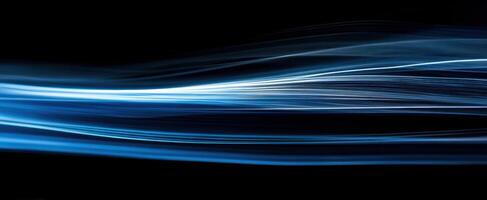 The Luminous Blue Wave Abstract Light Motion Against a Black Background photo