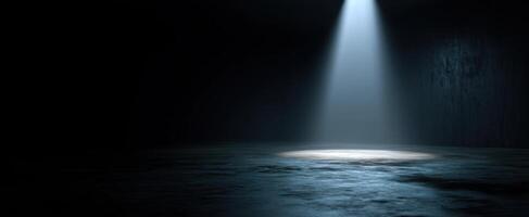 The spotlight illuminating an empty space in a dark environment. photo