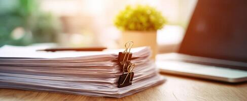 The accumulation of important documents on a stylish office desk photo