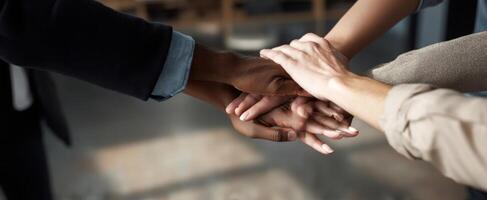 The hands of collaboration and teamwork coming together in unity. photo
