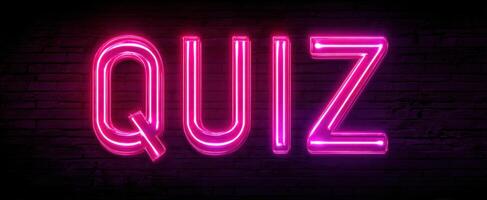 The Neon Quiz Sign Illuminating a Vibrant Nighttime Scene photo