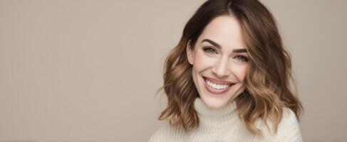 The woman smiling warmly in a cozy knitted sweater against a soft backdrop. photo