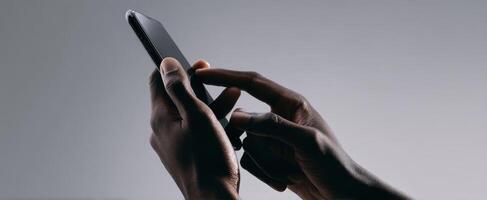 The Hands of a User Interacting with a Smartphone in a Modern Setting photo