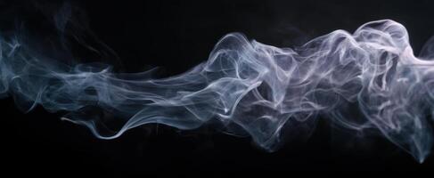 The delicate beauty of swirling smoke against a dark backdrop. photo