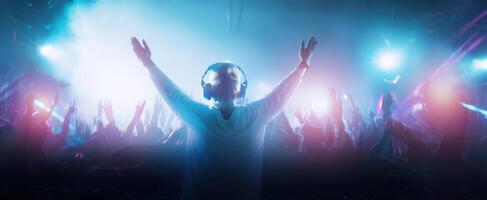 The DJ Energizes the Crowd with Vibrant Lights and Music at the Festival photo