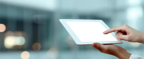 The sleek tablet held in hand with a blank screen for customization photo