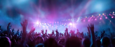 The vibrant crowd at a lively concert under colorful stage lights photo
