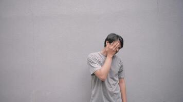 Expressing deep embarrassment, awkwardness, or shame against wall video