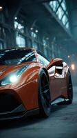 Sleek orange sports car parked in an industrial setting during twilight hours with dramatic lighting photo