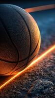 Basketball resting on textured surface with dramatic lighting effects in an urban setting photo