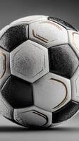 Soccer ball with unique texture resting on a surface displaying intricate patterns and lighting effects photo