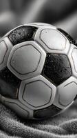 Soccer ball resting on a soft surface after a thrilling match during the afternoon photo