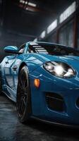 Blue sports car showcased in a well-lit garage with industrial backdrop featuring sleek lines and modern design photo