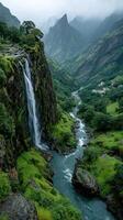 Waterfall cascading down a steep cliff surrounded by lush greenery in a misty mountainous landscape photo