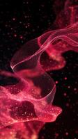 Vibrant red particles flow and swirl in a captivating abstract background design at night photo
