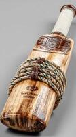 Cricket bat displayed on a neutral background emphasizing craftsmanship and design details photo