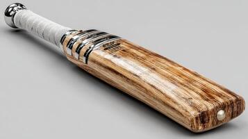 Unique cricket bat with intricate design made of high-quality wood displayed on a minimalist background photo