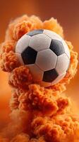 Soccer ball surrounded by orange smoke during dynamic action in an energetic sports setting photo