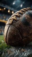 Close-up of a weathered football on the field during a game, showcasing the intricate details of the leather surface photo
