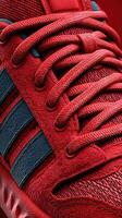 Vibrant red athletic shoe displayed against a contrasting background showcasing its unique features and design elements photo