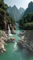 Glistening river flows through majestic mountains and lush greenery under a bright sky in a serene natural landscape photo