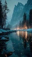 Majestic winter landscape with mountains, glowing lights, and a calm river at dusk photo