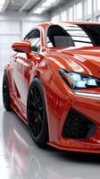 Sports car showcased in a sleek indoor setting with bright lighting and reflective surfaces photo