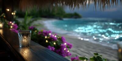 Evening by the beach with a sparkling drink and vibrant flowers in a tranquil coastal setting photo