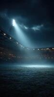 Nighttime stadium illuminated by floodlights with an empty field awaiting a match photo