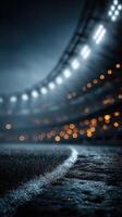 Dramatic lighting illuminates a deserted football stadium at night creating an atmospheric ambiance for future matches photo